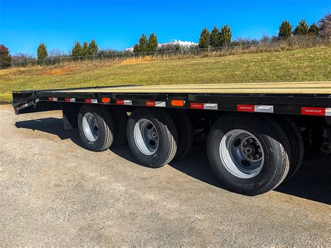 3 axle gooseneck flatbed with steel box on front|gooseneck trailers for sale.